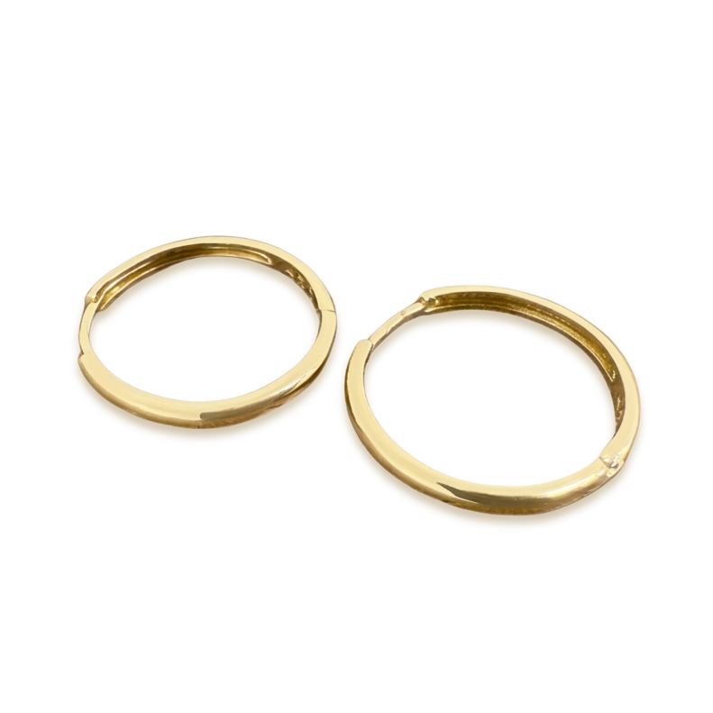 Two gold hoop earrings on a white background